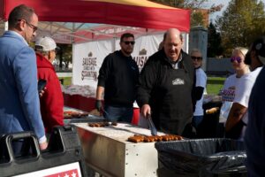 Brian Baumgartner Stands with Sausage. And Scranton.